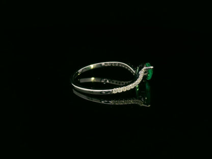 18K white gold emerald and diamond crossover ring with marquise-cut 0.65 carat emerald