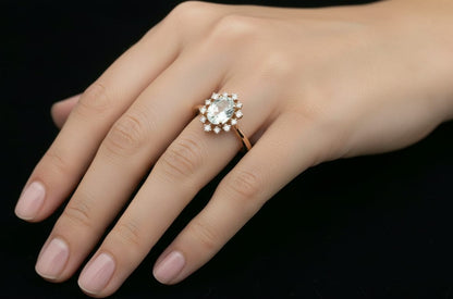 0.71 ct aquamarine and diamond halo ring in 18K rose gold with floral vintage-inspired design 