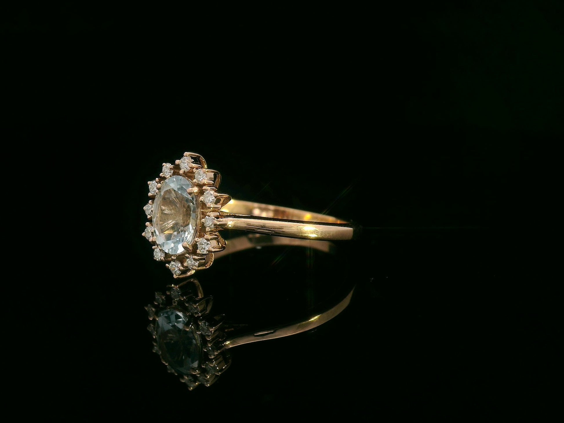 0.71 ct aquamarine and diamond halo ring in 18K rose gold with floral vintage-inspired design 