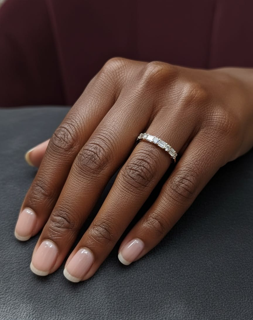 18K yellow gold half eternity diamond band featuring alternating baguette and round-cut diamonds 