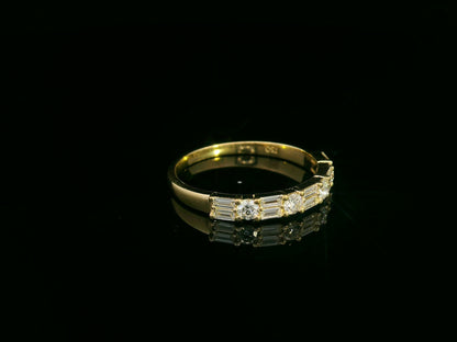 18K yellow gold half eternity diamond band featuring alternating baguette and round-cut diamonds 