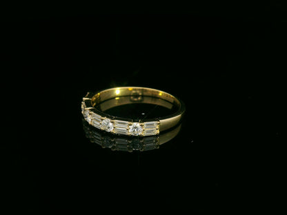 18K yellow gold half eternity diamond band featuring alternating baguette and round-cut diamonds 