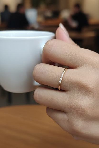 Dainty diamond stacking ring in 18K yellow gold by Emirates Diamonds