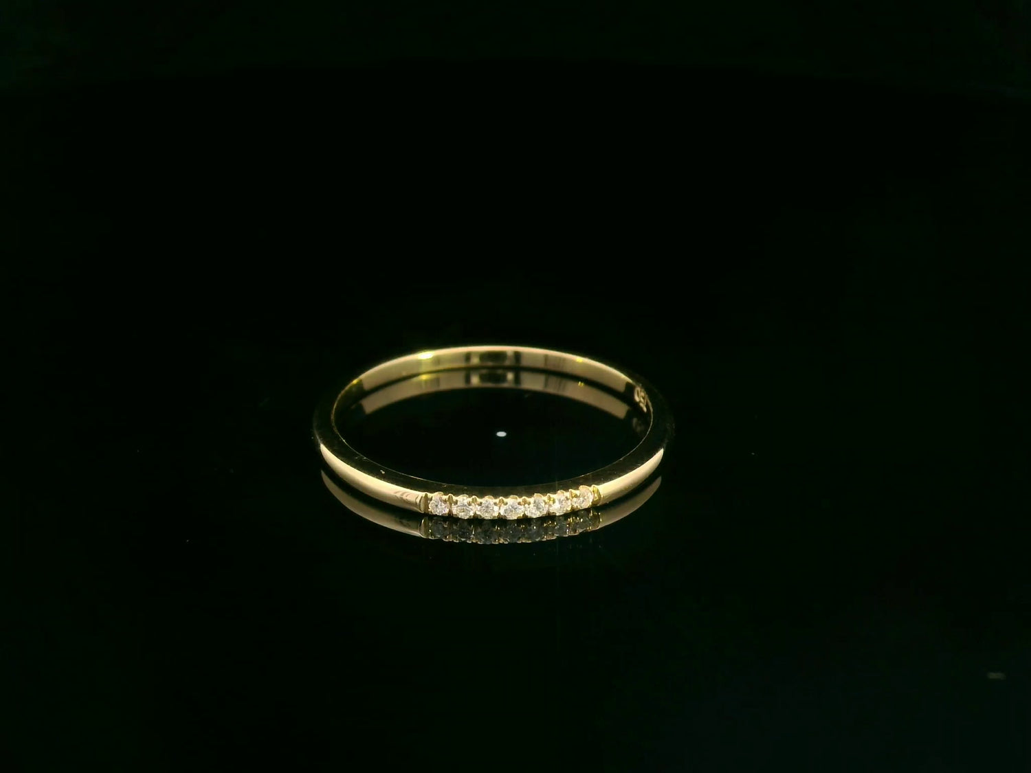 Dainty diamond stacking ring in 18K yellow gold by Emirates Diamonds