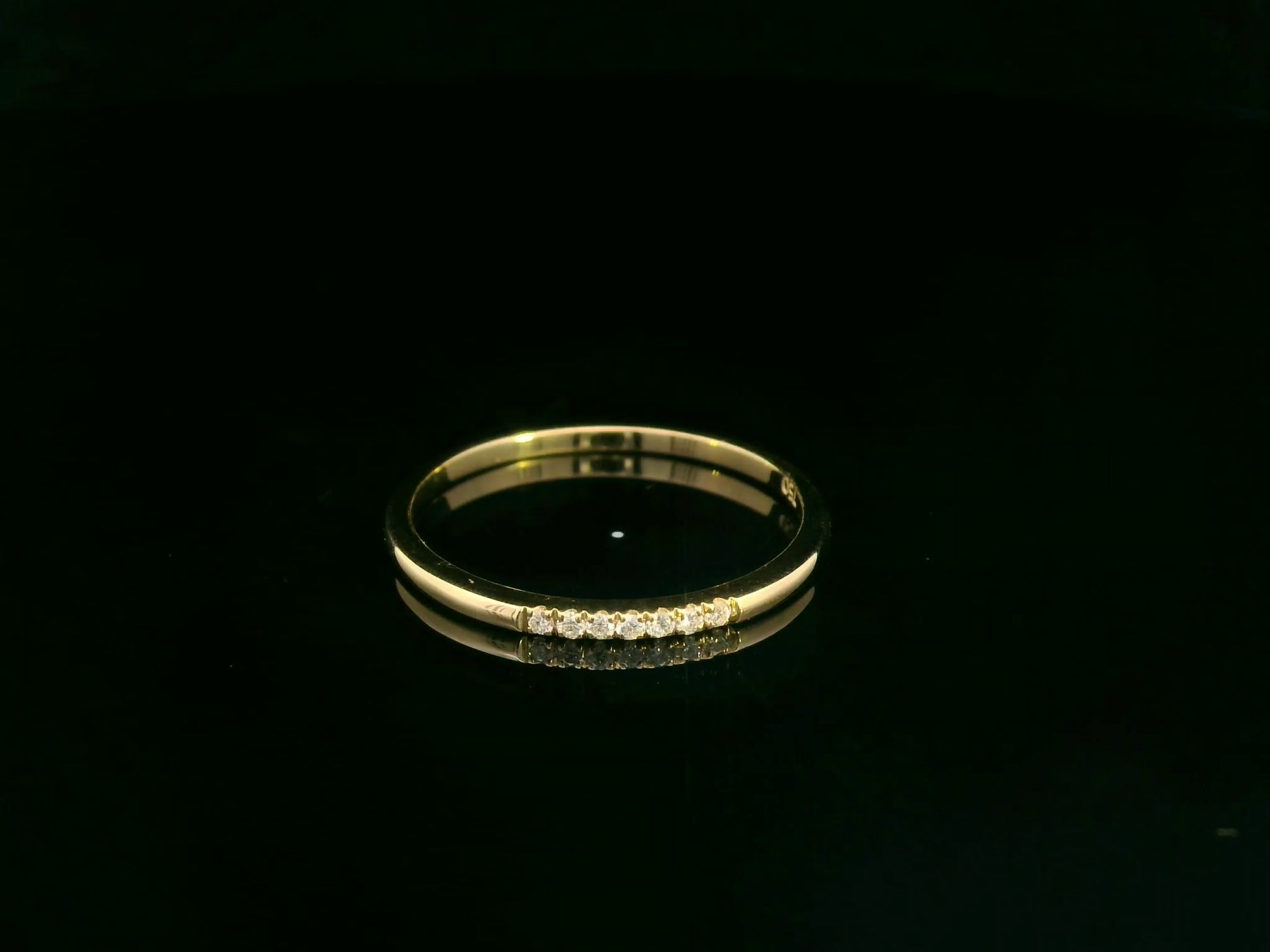 Dainty diamond stacking ring in 18K yellow gold by Emirates Diamonds