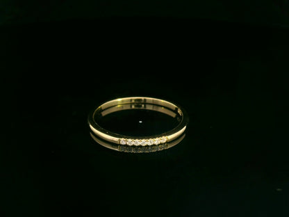Dainty diamond stacking ring in 18K yellow gold by Emirates Diamonds