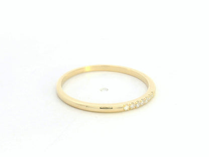 Dainty diamond stacking ring in 18K yellow gold by Emirates Diamonds