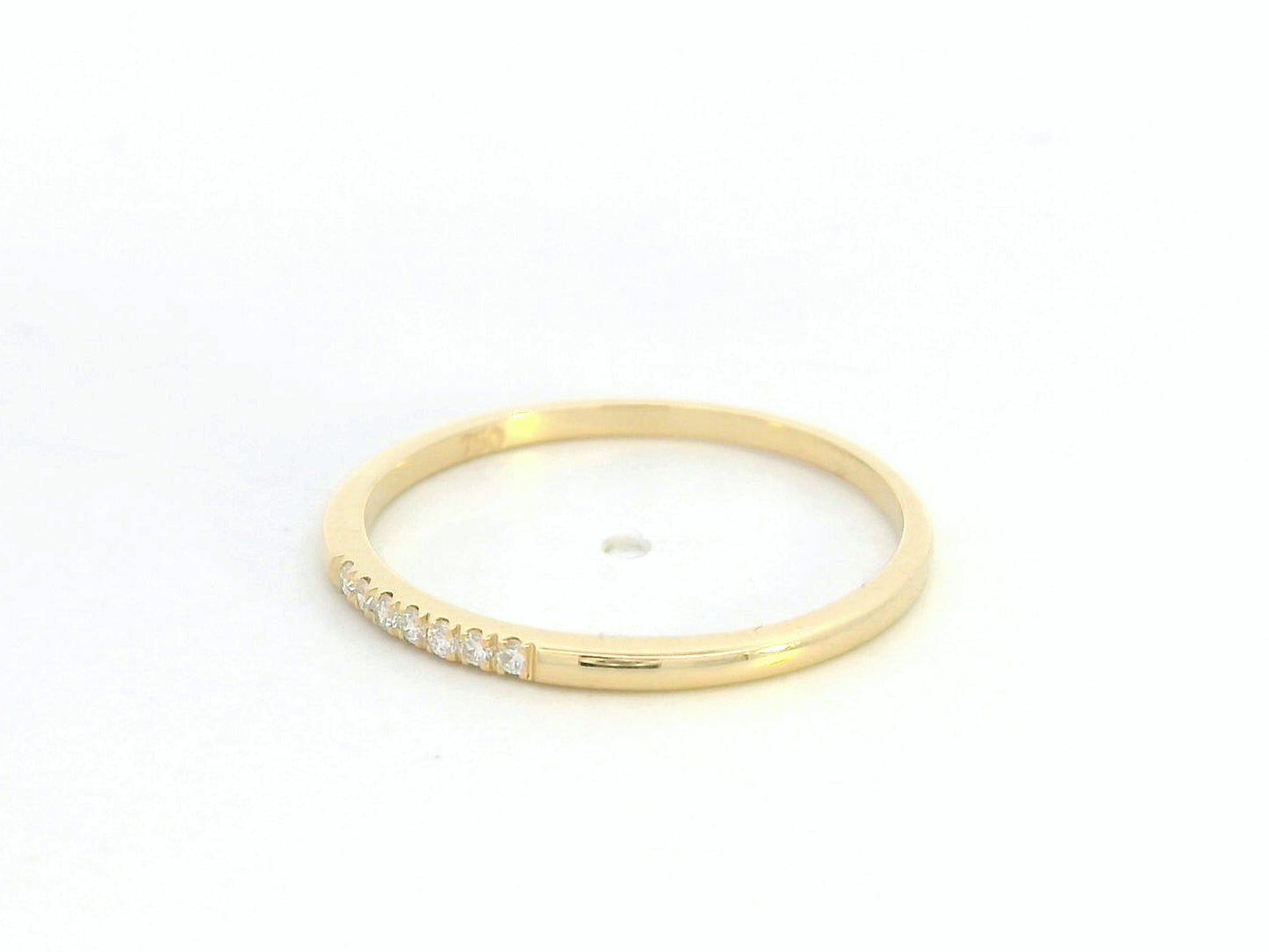 Dainty diamond stacking ring in 18K yellow gold by Emirates Diamonds