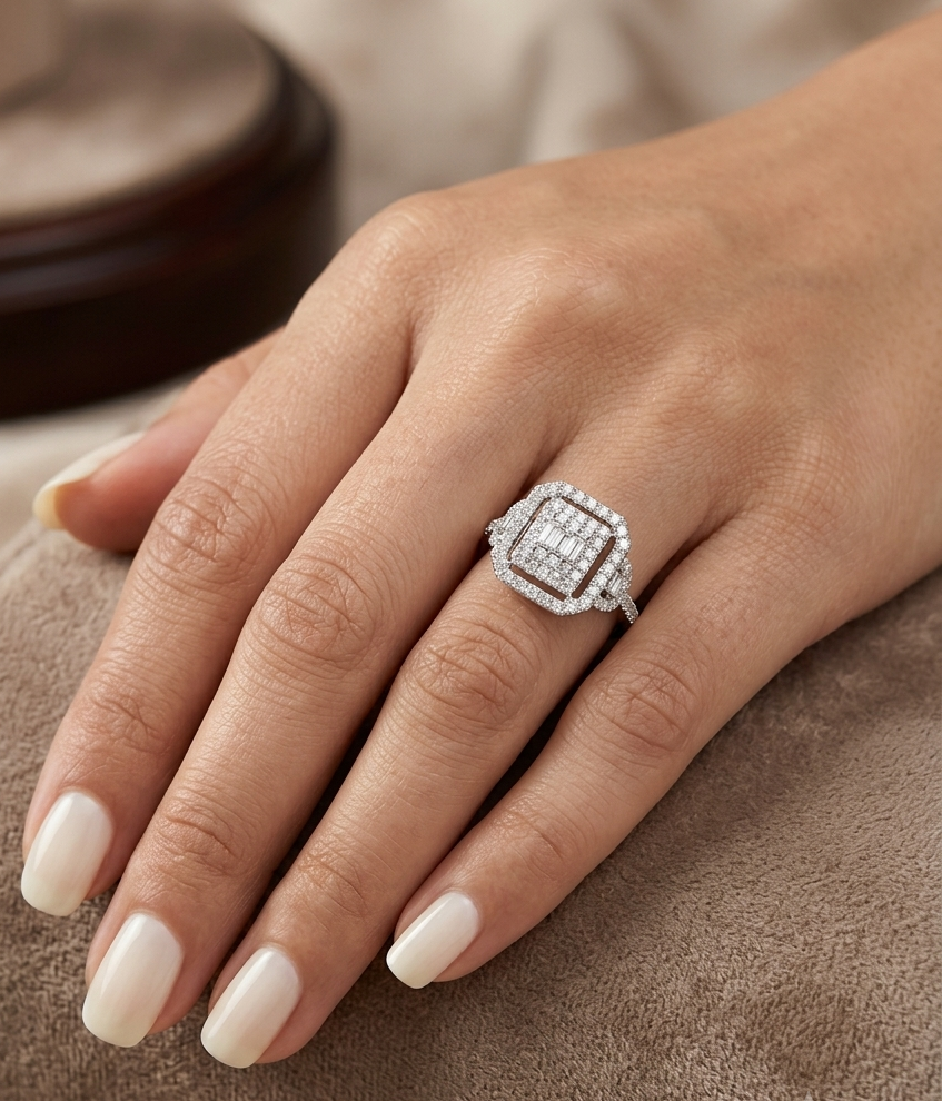 18K white gold statement ring featuring 0.09 carat natural baguette diamonds surrounded by 0.72 carat natural round brilliant diamonds in a geometric double halo design.