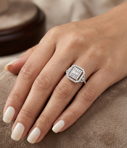 18K white gold statement ring featuring 0.09 carat natural baguette diamonds surrounded by 0.72 carat natural round brilliant diamonds in a geometric double halo design.