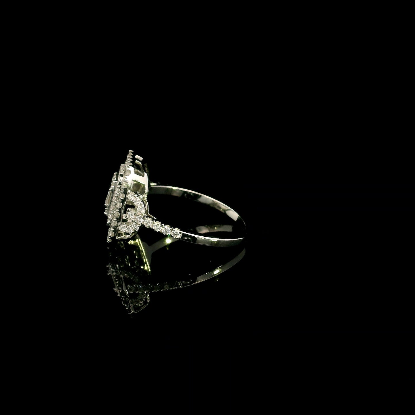 18K white gold statement ring featuring 0.09 carat natural baguette diamonds surrounded by 0.72 carat natural round brilliant diamonds in a geometric double halo design.
