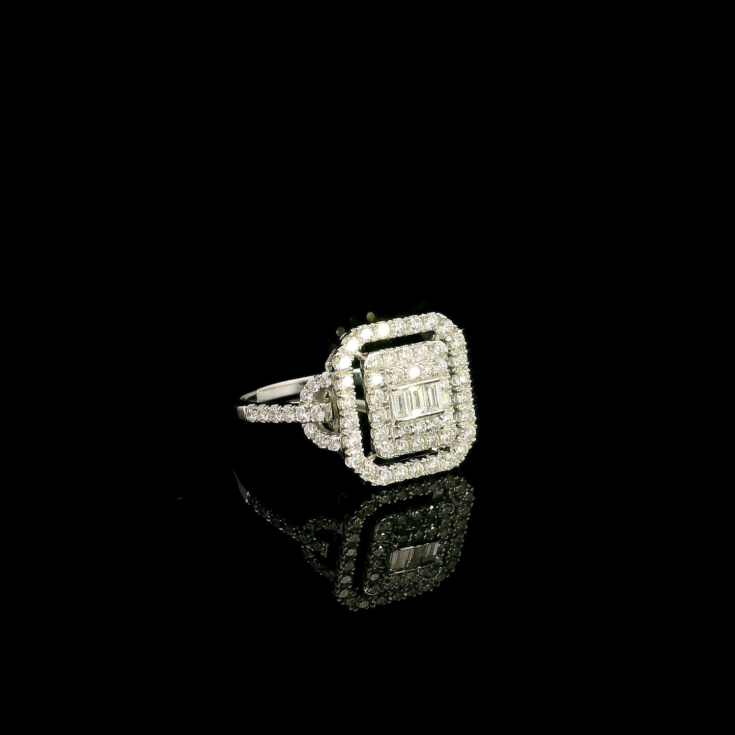 18K white gold statement ring featuring 0.09 carat natural baguette diamonds surrounded by 0.72 carat natural round brilliant diamonds in a geometric double halo design.