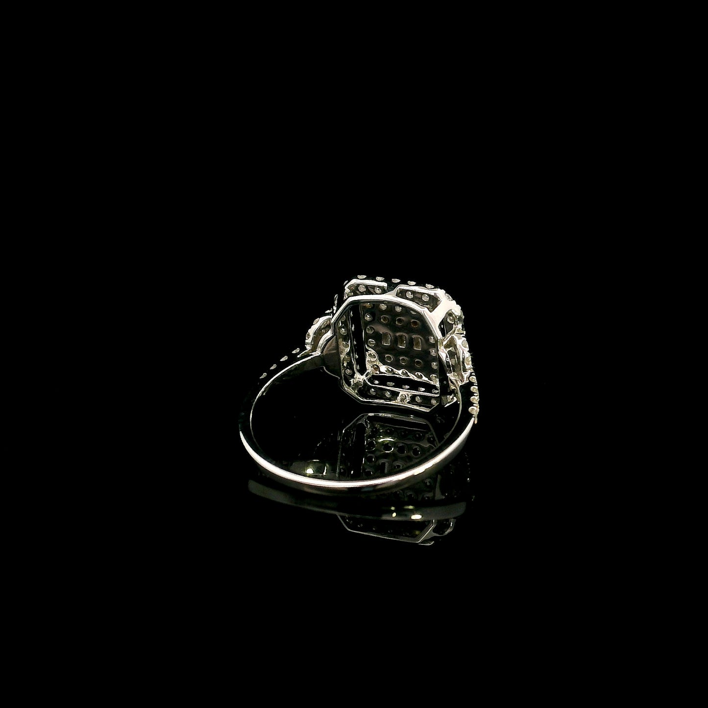 18K white gold statement ring featuring 0.09 carat natural baguette diamonds surrounded by 0.72 carat natural round brilliant diamonds in a geometric double halo design.