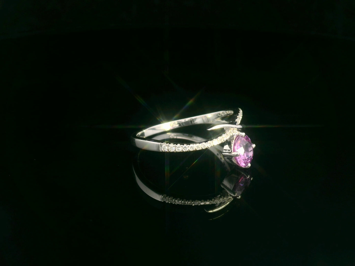 Pink sapphire and diamond bypass ring in 18K white gold by Emirates Diamonds