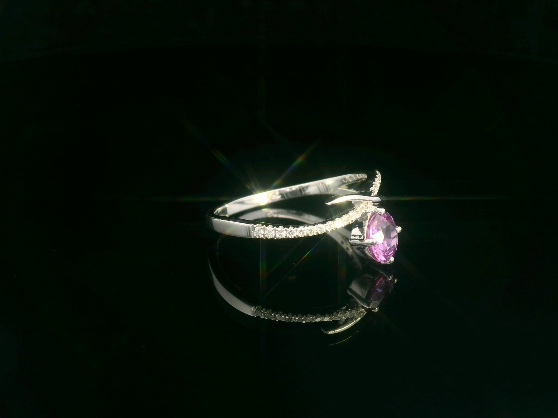 Pink sapphire and diamond bypass ring in 18K white gold by Emirates Diamonds