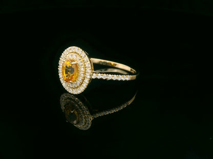 Oval yellow sapphire ring, 0.80 carat with 0.42 carat diamonds, 18K yellow gold, luxury statement ring by Emirates Diamonds