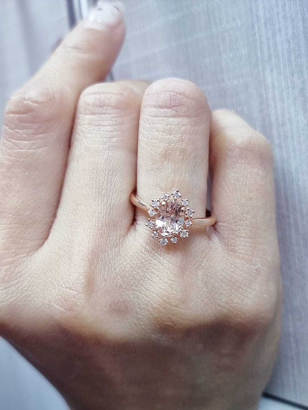 Oval-cut morganite and diamond ring in 18K rose gold, featuring a 1.03 carat morganite with a unique sunburst diamond halo, vintage Art Deco design by Emirates Diamonds