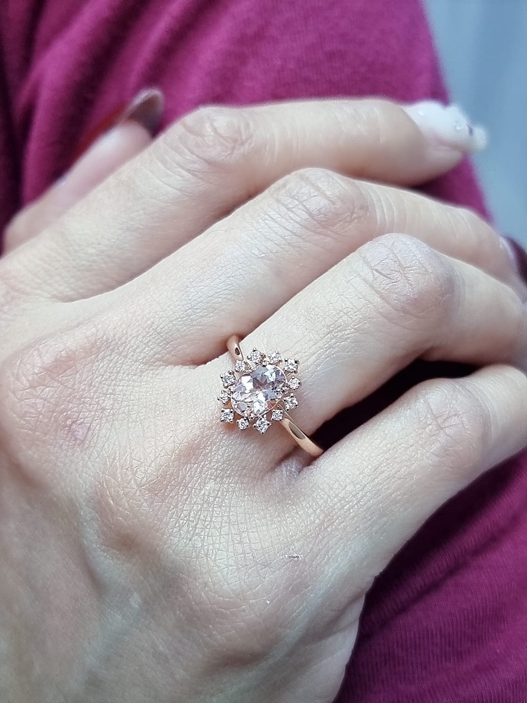 Oval-cut morganite and diamond ring in 18K rose gold, featuring a 1.03 carat morganite with a unique sunburst diamond halo, vintage Art Deco design by Emirates Diamonds