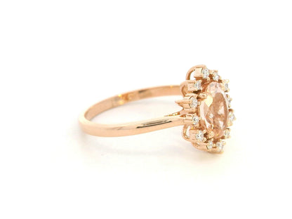 Oval-cut morganite and diamond ring in 18K rose gold, featuring a 1.03 carat morganite with a unique sunburst diamond halo, vintage Art Deco design by Emirates Diamonds