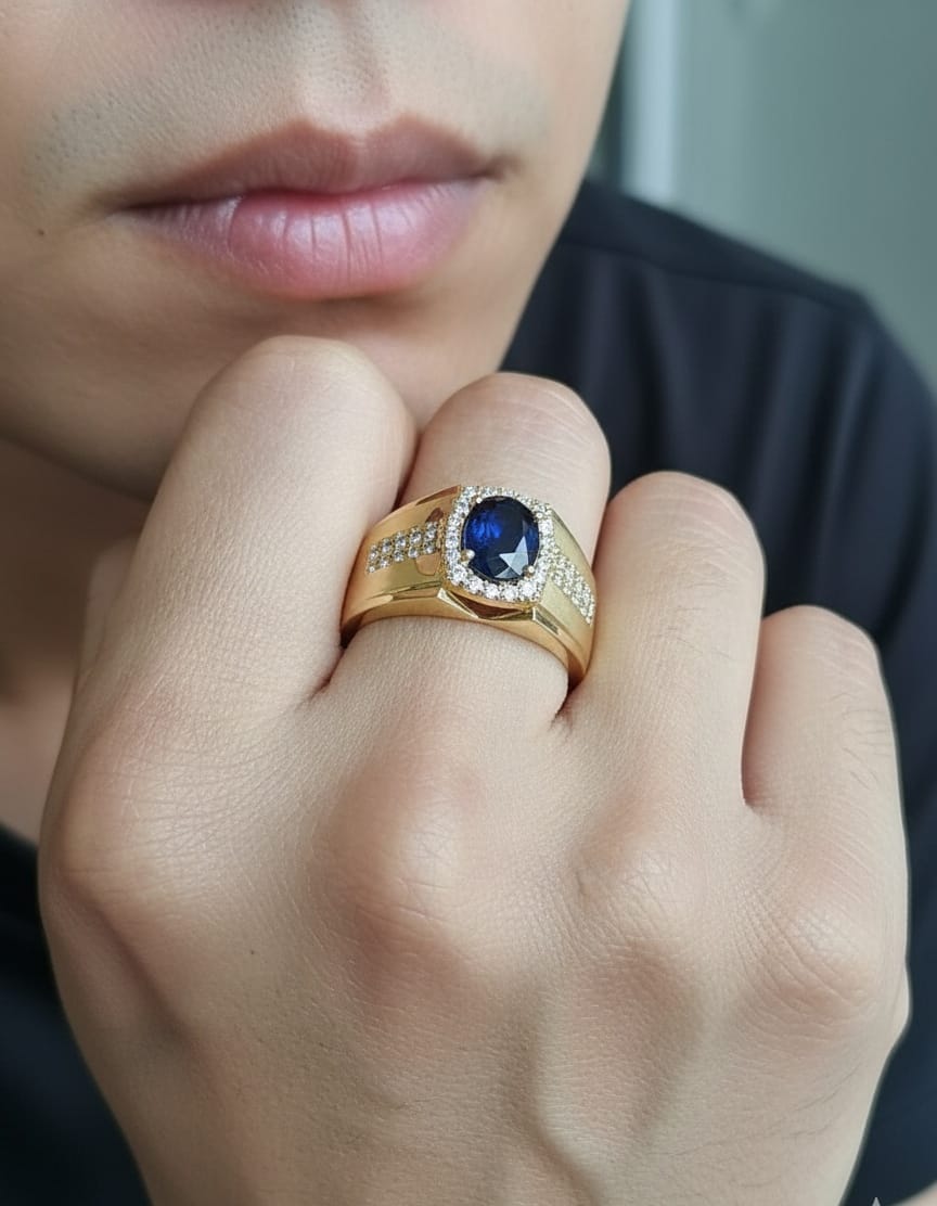 Men’s blue sapphire and diamond ring in 18K yellow gold featuring a 1.93 carat oval sapphire with halo and pavé-set side diamonds – Emirates Diamonds