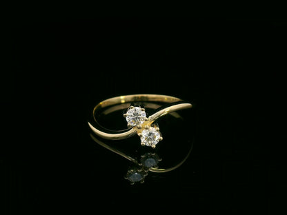 “Toi et Moi” diamond ring in 18K yellow gold with two round-cut diamonds, timeless elegance by Emirates Diamonds
