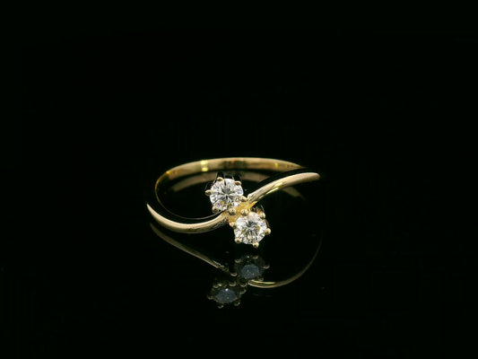 “Toi et Moi” diamond ring in 18K yellow gold with two round-cut diamonds, timeless elegance by Emirates Diamonds