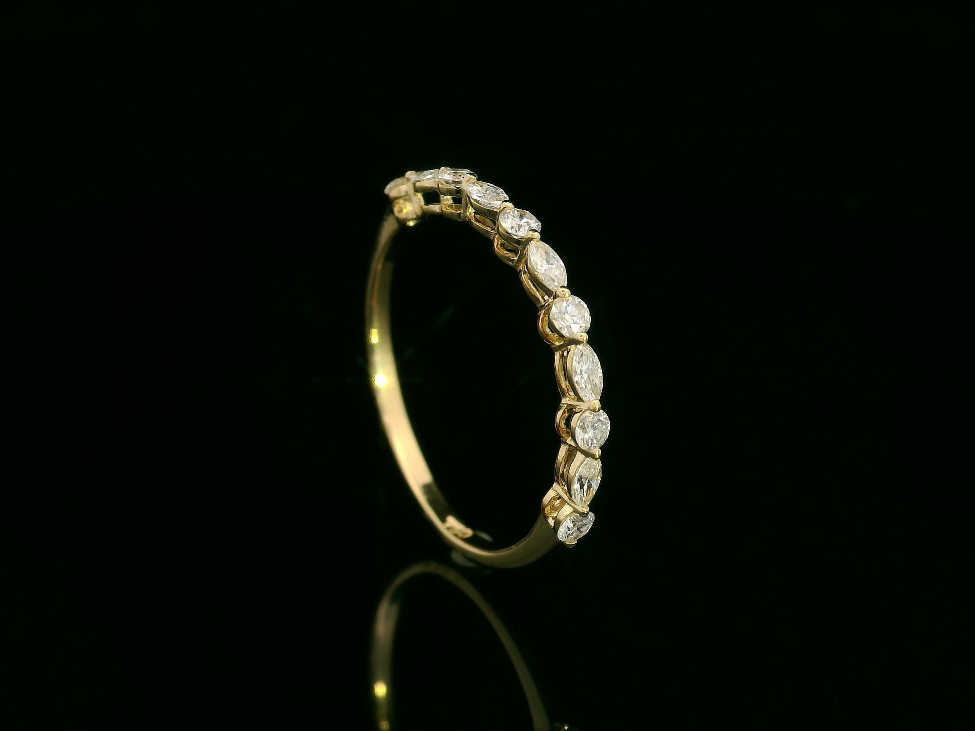 18K yellow gold diamond band featuring alternating marquise and round diamonds – elegant stackable fine jewelry by Emirates Diamonds.
