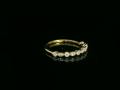 18K yellow gold diamond band featuring alternating marquise and round diamonds – elegant stackable fine jewelry by Emirates Diamonds.