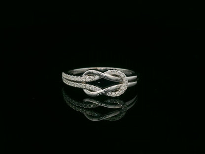 18K white gold diamond knot ring with pavé-set diamonds – minimalist symbolic jewelry by Emirates Diamonds