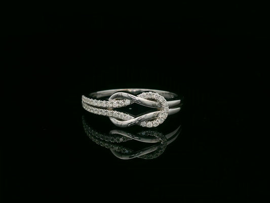 18K white gold diamond knot ring with pavé-set diamonds – minimalist symbolic jewelry by Emirates Diamonds
