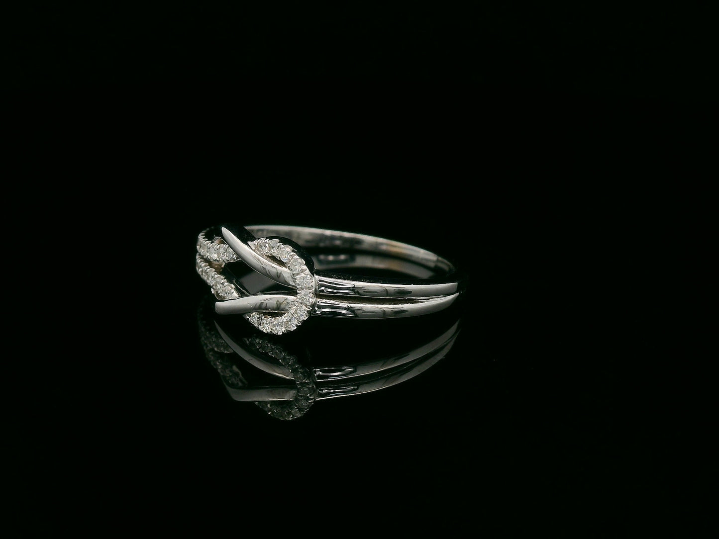 18K white gold diamond knot ring with pavé-set diamonds – minimalist symbolic jewelry by Emirates Diamonds