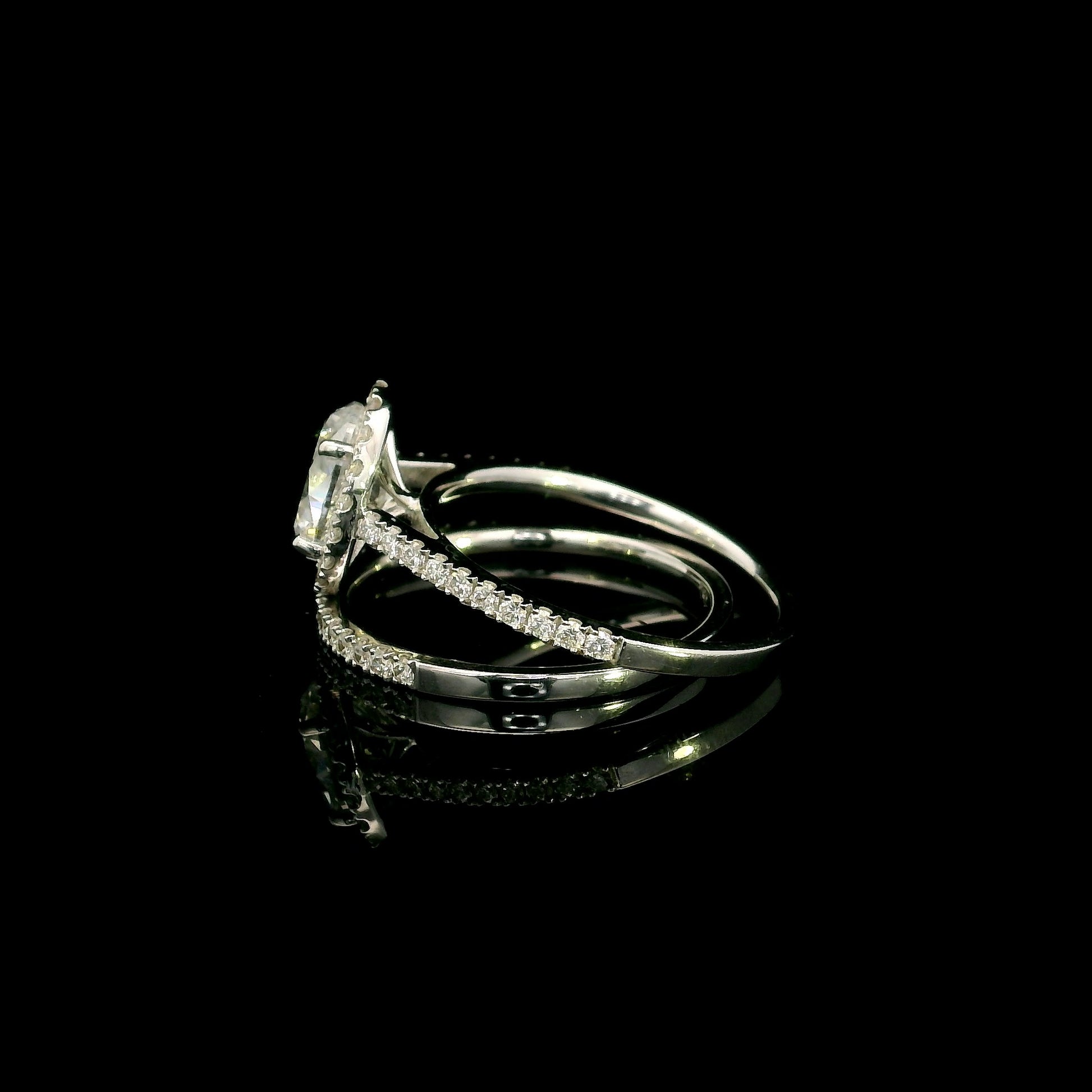 Oval diamond bridal set in 18K white gold with GIA certified natural diamond halo engagement ring and matching diamond wedding band