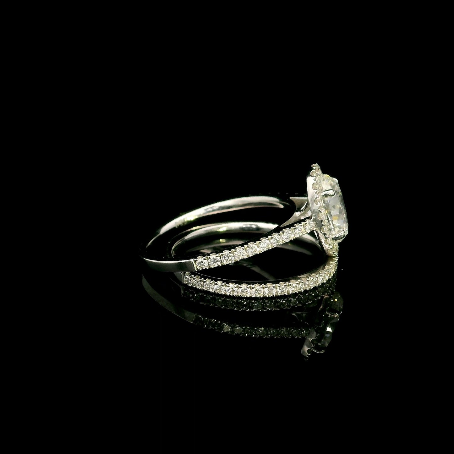 Oval diamond bridal set in 18K white gold with GIA certified natural diamond halo engagement ring and matching diamond wedding band