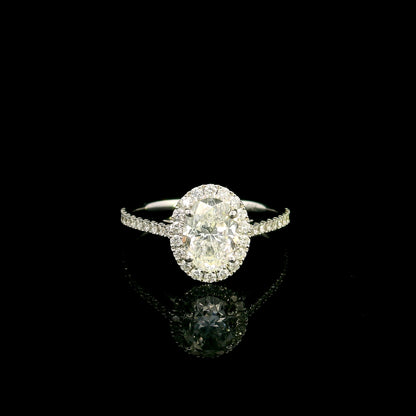 Oval diamond bridal set in 18K white gold with GIA certified natural diamond halo engagement ring and matching diamond wedding band