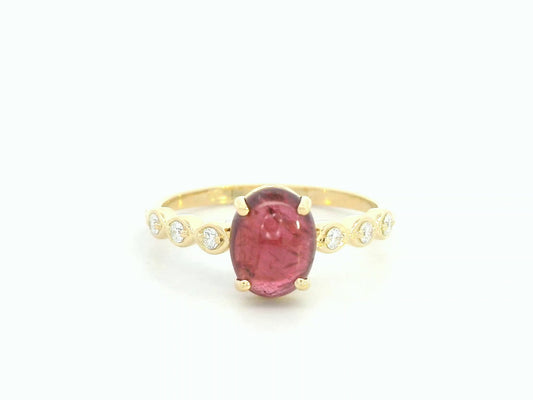 18K yellow gold ring with 1.66ct cabochon ruby and 0.10ct diamond accents – Emirates Diamonds.