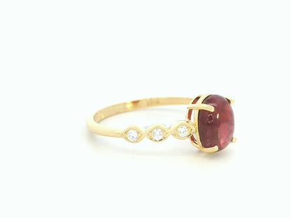 18K yellow gold ring with 1.66ct cabochon ruby and 0.10ct diamond accents – Emirates Diamonds.