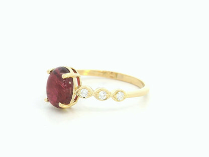 18K yellow gold ring with 1.66ct cabochon ruby and 0.10ct diamond accents – Emirates Diamonds.