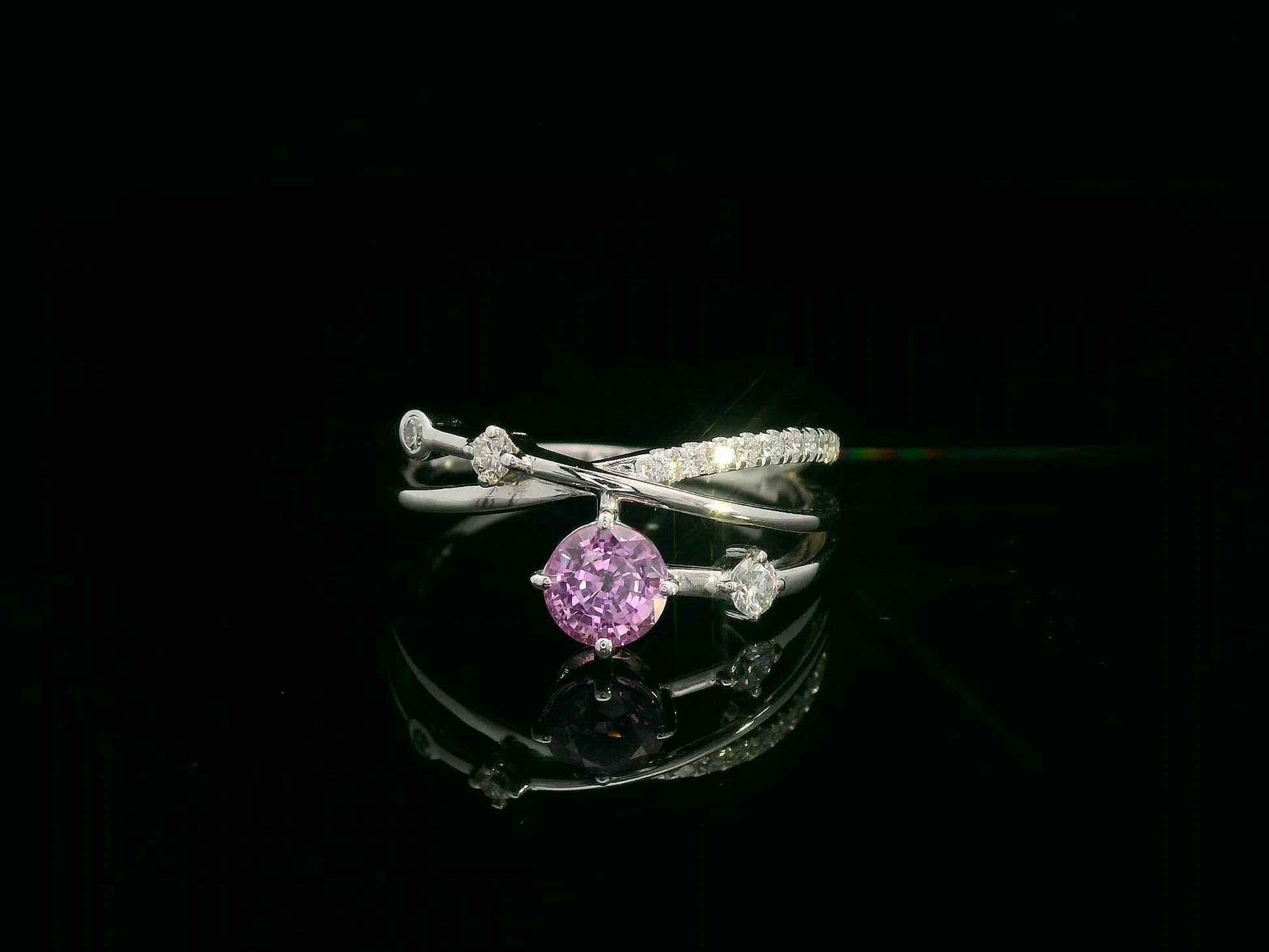 18K white gold bypass ring with 0.76ct round pink sapphire and 0.19ct diamond accents – Emirates Diamonds