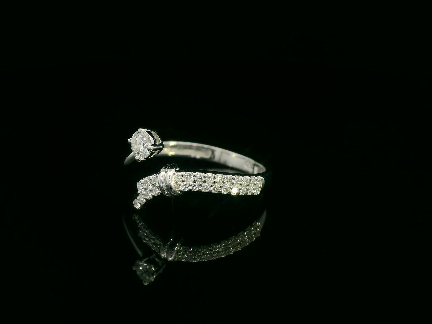 18K white gold diamond bypass ring with round center diamond and pavé side band – Emirates Diamonds