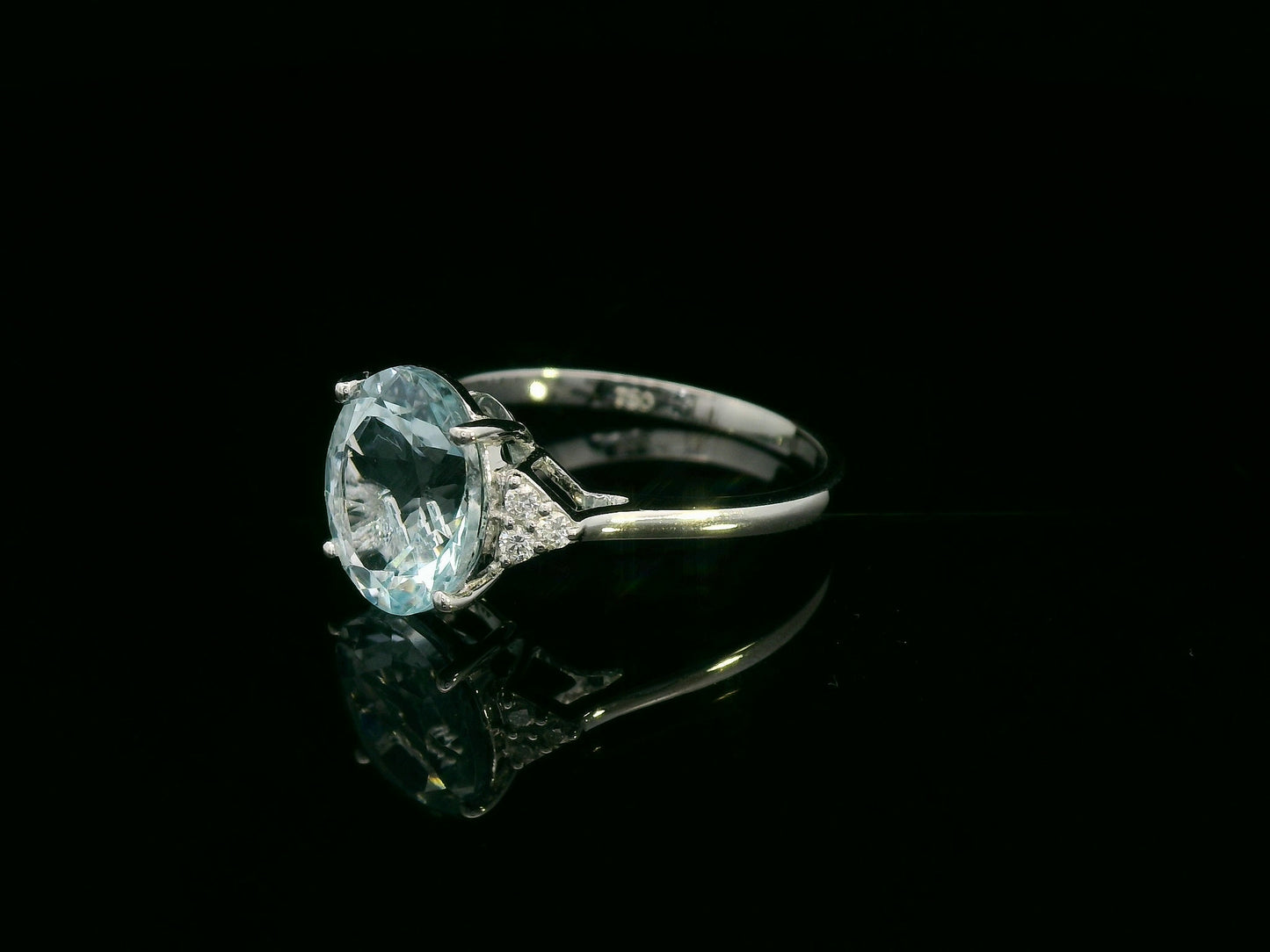 18K white gold oval aquamarine ring with diamond side clusters – 2.45ct aquamarine, 0.08ct diamonds by Emirates Diamonds