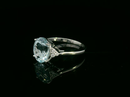 18K white gold oval aquamarine ring with diamond side clusters – 2.45ct aquamarine, 0.08ct diamonds by Emirates Diamonds