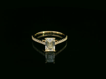 Emerald-cut diamond engagement ring and pavé wedding band bridal set in 18K yellow gold – Emirates Diamonds.