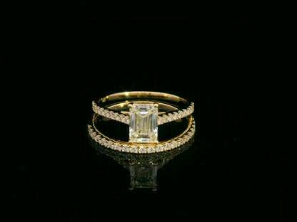 Emerald-cut diamond engagement ring and pavé wedding band bridal set in 18K yellow gold – Emirates Diamonds.