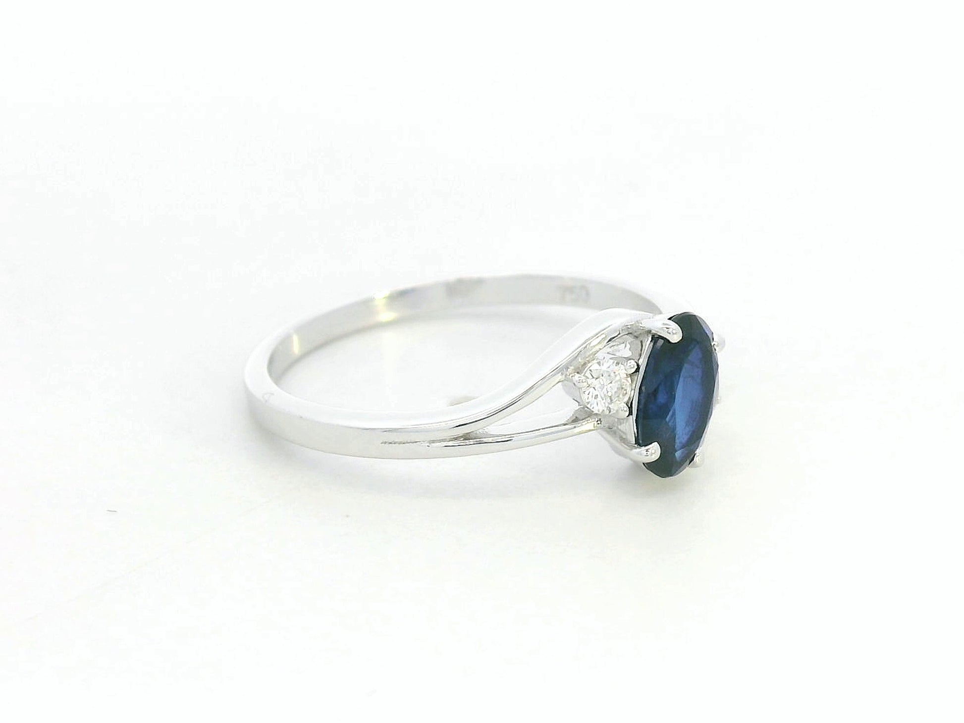 18K white gold sapphire and diamond ring – 0.84ct oval sapphire three-stone design by Emirates Diamonds