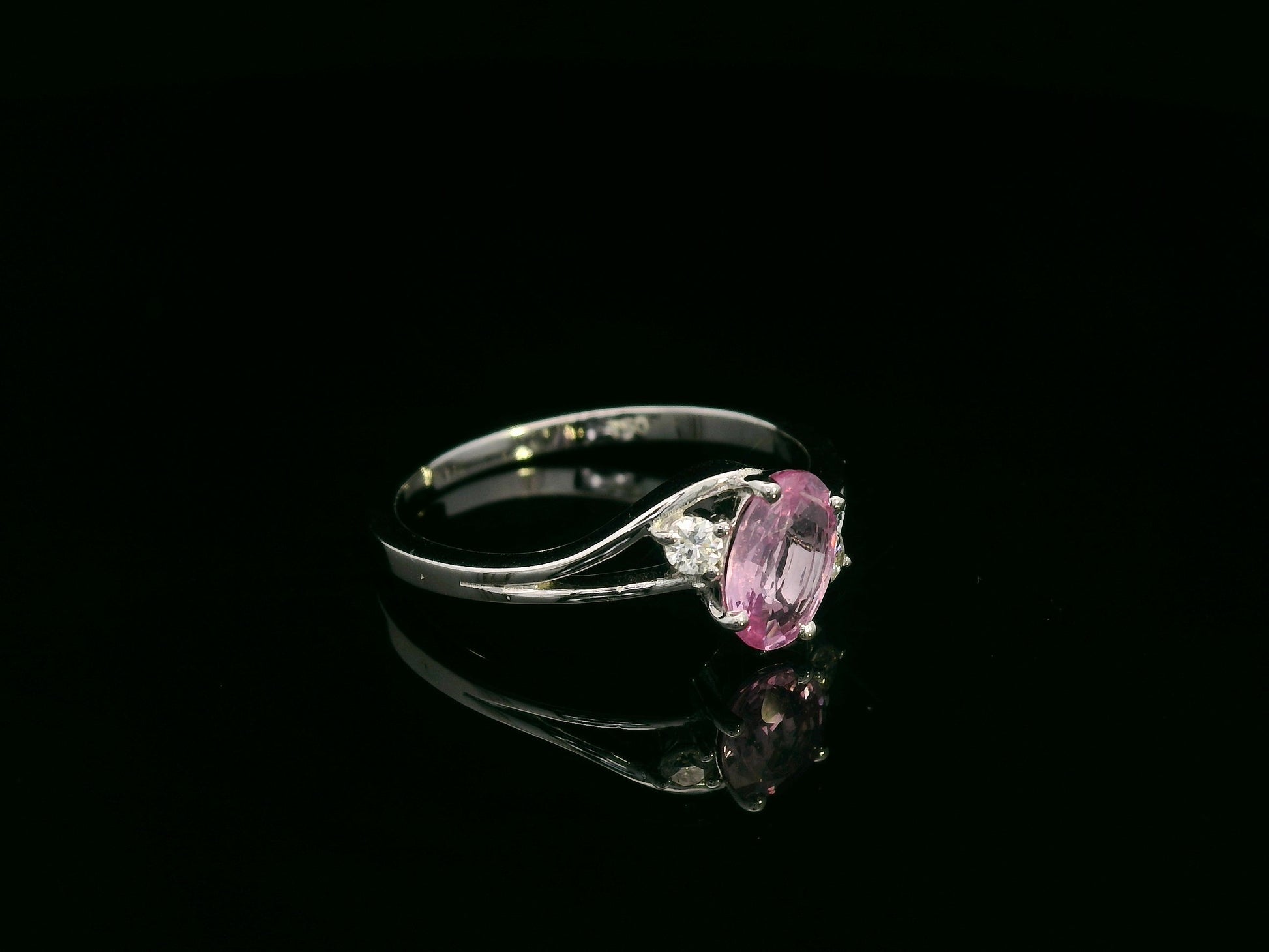 18K white gold ring with 0.81ct oval pink sapphire and diamond accents – Emirates Diamonds.