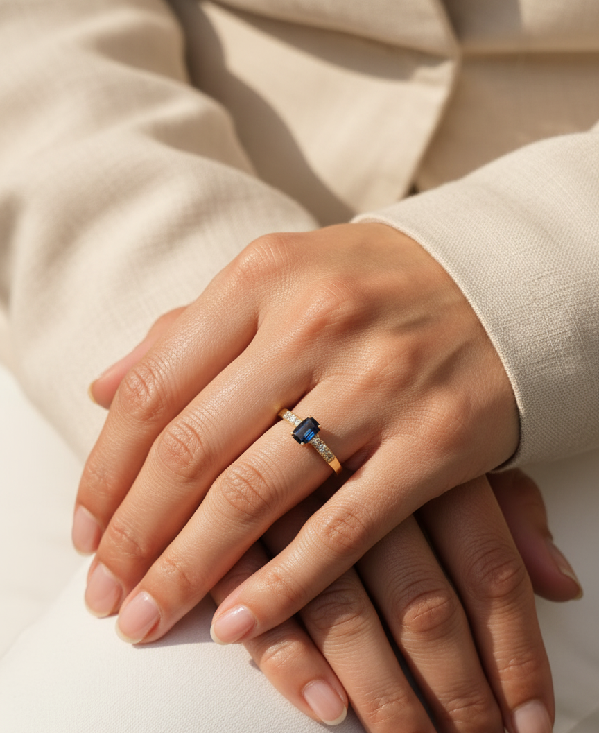 18K yellow gold emerald-cut blue sapphire and diamond ring – 0.46ct sapphire, 0.23ct diamonds by Emirates Diamonds