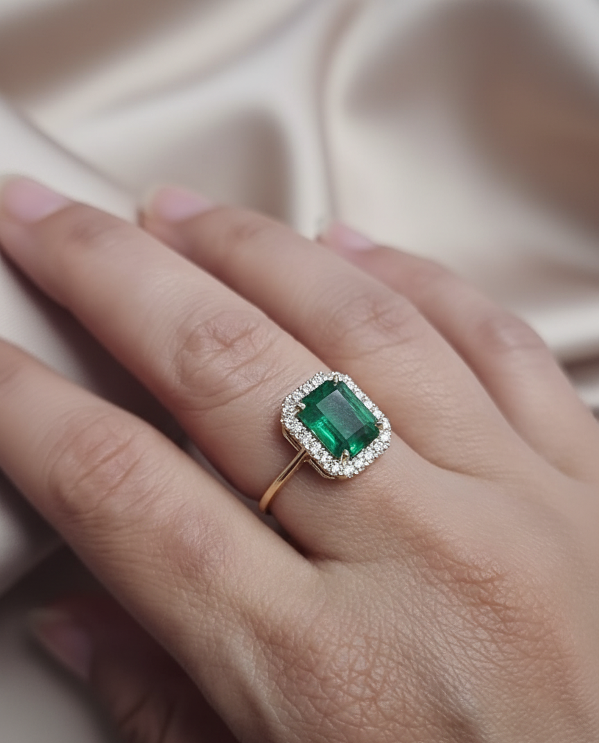 18K yellow gold emerald ring – 2.70ct emerald-cut emerald with 0.34ct diamond halo by Emirates Diamonds