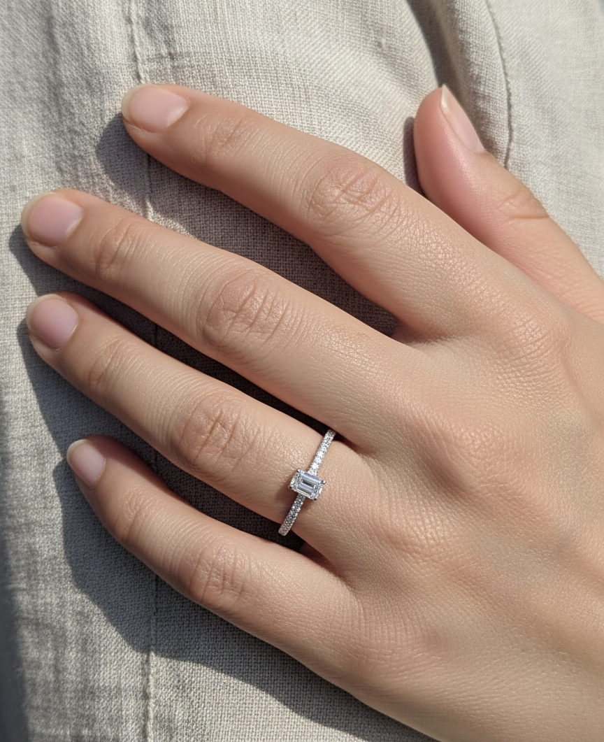 Emerald-cut diamond ring in 18K white gold with pavé band – 0.40ct D/VS1 GIA center stone by Emirates Diamonds.