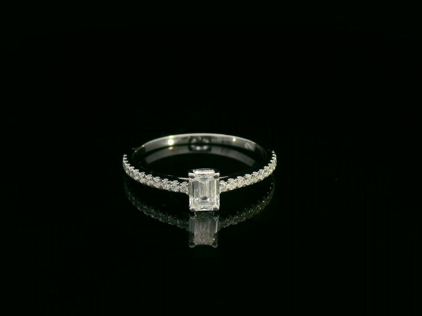 Emerald-cut diamond ring in 18K white gold with pavé band – 0.40ct D/VS1 GIA center stone by Emirates Diamonds.