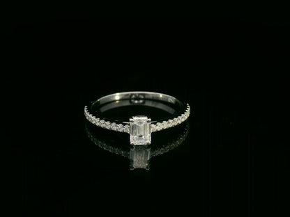 Emerald-cut diamond ring in 18K white gold with pavé band – 0.40ct D/VS1 GIA center stone by Emirates Diamonds.